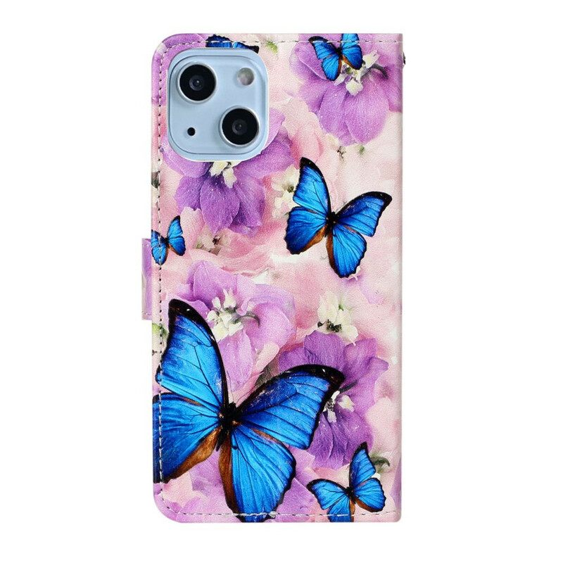 Nahkakotelo iPhone 13 Mini Sinisiä Perhosia Kukissa